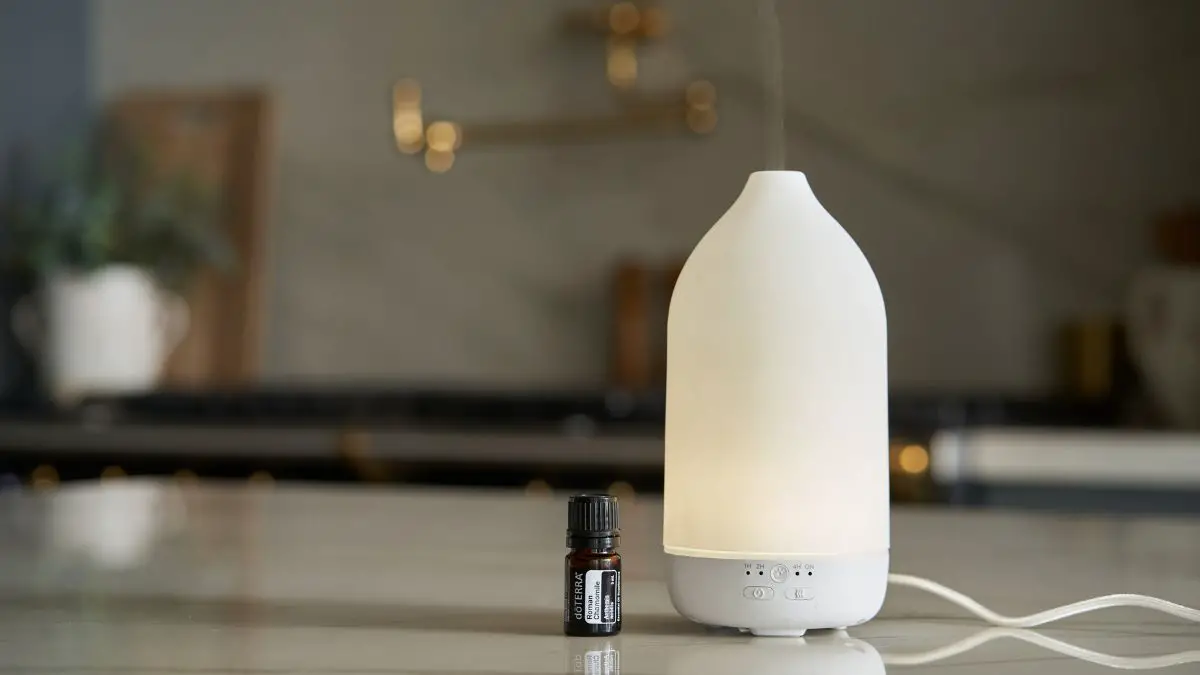 Essential oil and white diffuser on countertop