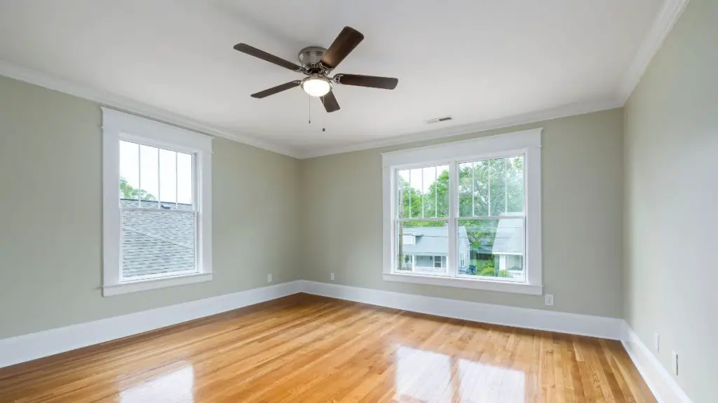 An Empty Living Room with Ceiling Fan